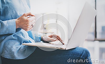 Photo young business woman working with new startup project in office. Modern notebook holding hands, cup of coffee Stock Photo