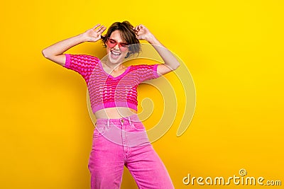 Photo of young carefree attractive lady wear pink stylish knitted crop top summertime sunglass dance have fun isolated Stock Photo