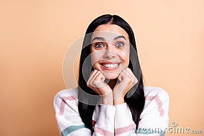 Photo of young cheerful attractive girl happy positive smile excited hands touch chin dream isolated over beige color Stock Photo