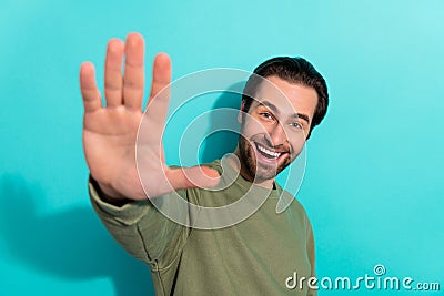 Photo of young cheerful guy good mood wave hi glad meet friends isolated over teal color background Stock Photo