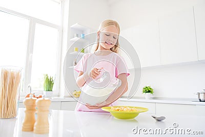 Photo of young cheerful small girl happy positive smile lunch eat crispy muesli dairy healthy food indoors Stock Photo
