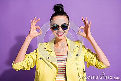 Photo of young cheerful smiling attractive girl woman female showing sign okay two hands isolated on violet color Stock Photo