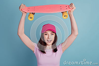 Photo of young excited girl happy positive smile hold skateboard rider sport isolated turquoise color background Stock Photo