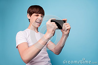 Photo of young gamer decided to conquer peaks of cyber sport moment before mother comes in and makes him do homework Stock Photo