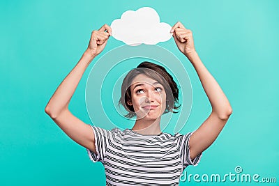 Photo of young girl hold paper cloud advertise weather rain isolated over turquoise color background Stock Photo