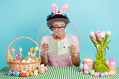 Photo of young good mood guy reading greetings postcard spring letter easter congratulate happy holiday isolated on Stock Photo