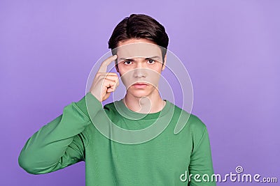 Photo of young guy finger touch head think memory accuse idiot blame isolated over violet color background Stock Photo