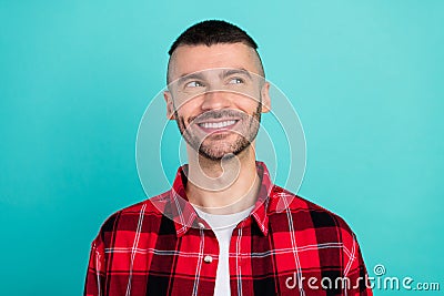 Photo of young happy positive thoughtful man look empty space good mood smile isolated on teal color background Stock Photo