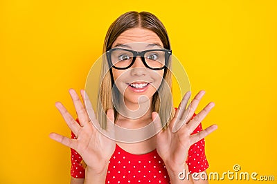 Photo of young lovely excited girl eyewear reaction information isolated over yellow color background Stock Photo