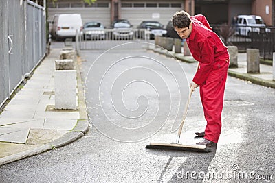 Portrait of young male street sweeper Stock Photo