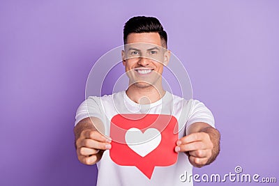 Photo of young man happy positive smile show heart like icon blogger click advise advert isolated over purple color Stock Photo