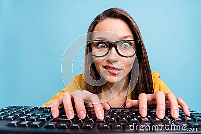 Photo of young pretty woman bite lips teeth worried nervous typing keyboard computer isolated over blue color background Stock Photo
