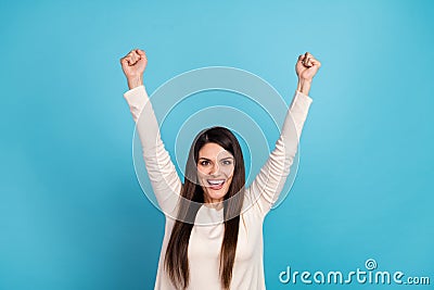 Photo of young pretty woman rejoice luck fists hands hooray triumph over blue color background Stock Photo