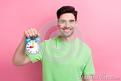 Photo of young satisfied man brunet hair model hold toy oclock punctuality every day routine schedule isolated on pink Stock Photo