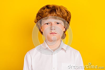 Photo of young serious calm peaceful thoughtful schoolboy thinking brainstorming isolated on yellow color background Stock Photo