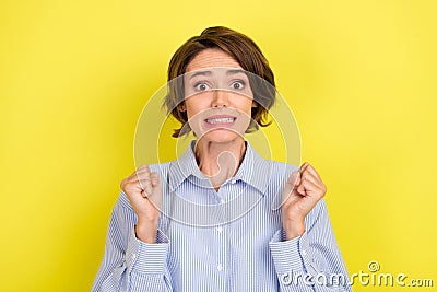 Photo of young woman anxious worried fail problem wait expect success isolated over yellow color background Stock Photo