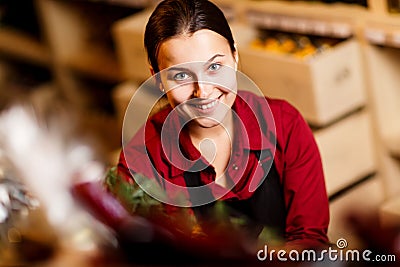 Photo of young woman with bottle in hands in wine shop Stock Photo