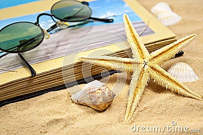 Photoalbum with souvenirs and shells with sand Stock Photo
