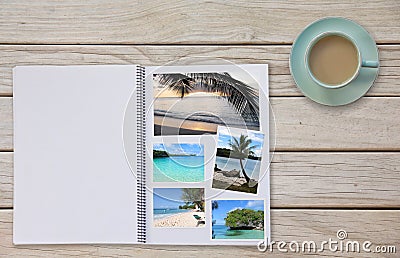 Photobook Album on Deck Table with Travel Photos Coffee or Tea in Cup Stock Photo