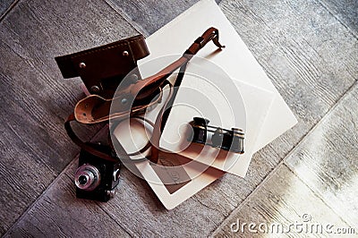 Photobook in bright leather, retro binoculars and old camera. Creative Stock Photo