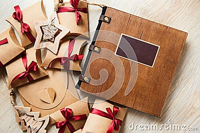 Photobook in a wooden cover and wooden toys Stock Photo