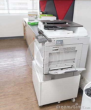Photocopier with access control for scanning key card in office Stock Photo