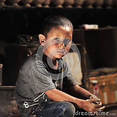 A young kid was potting apprentice Editorial Stock Photo