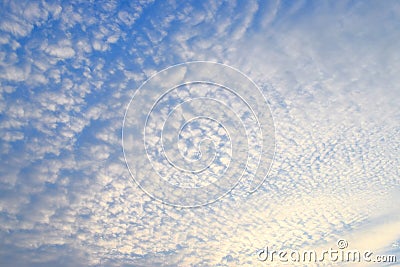 Abstract Pattern of White Cirrocumulus Clouds in Infinite Blue Sky - Natural Background Stock Photo