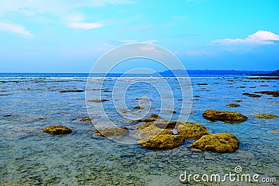 Blue Landscape - Clean Sea Water at Rocky Beach and Sky - Natural Background - Laxmanpur, Neil Island, Andaman Nicobar, India Stock Photo