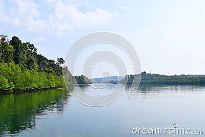 Backwater with Greenery on both Banks with Clear Water and Sky - River on Great Andaman Trunk Road, Baratang Island, India Stock Photo