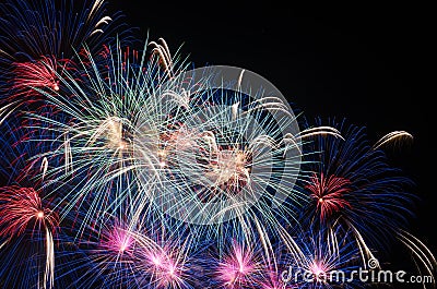 Colourful fireworks in the night sky over city Stock Photo