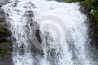 Forceful Fall of Water with Sprinkling of White Water Drops - Cheeyappara Waterfalls, Idukki, Kerala, India Stock Photo