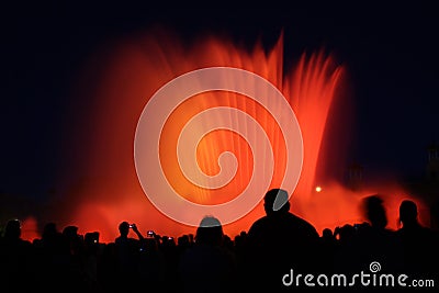 Photograph of the colored water fountains during the night show near Plaza EspaÃ±a. Editorial Stock Photo