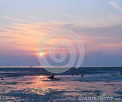 Sunrise with Golden Sun and its Reflection in Water and Colorful Sky - Vijaynagar Beach, Havelock Island, Andaman, India Stock Photo