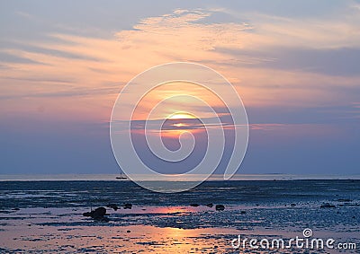 Sunrise with Golden Sun behind Clouds and Colorful Sky - Vijaynagar Beach, Havelock Island, Andaman, India Stock Photo