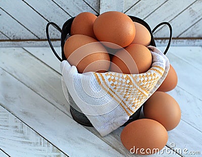 photograph of Eggs close up inside a bucket Stock Photo