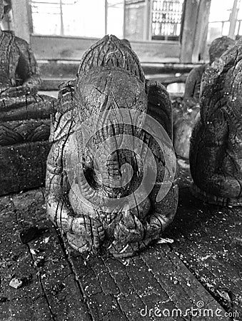 Ganesha statue (Patung Ganesha). Black statue from stone. The Ganesha God is believed to repel bad luck. Stock Photo