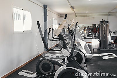 Photograph of a gym with exercise machines. Ellipticals, treadmills. sport concept Stock Photo