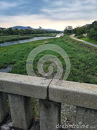 Kamogawa River in Kyoto, upstream on overcast day Stock Photo