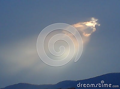 Sunbeam ouverture in a cloudy sky Stock Photo