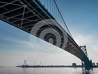 Large Bridge over a River with a Blue Morning Sky - Underneath a Bridge Editorial Stock Photo