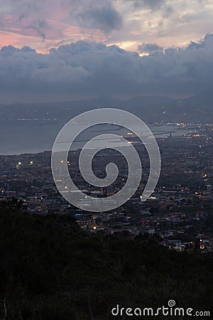 Photograph taken on Mount Vesuvius, Italy, capturing a sunset view of the entire city of Naples Stock Photo