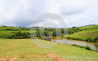 Lake in Vagamon Meadows - Greenery against Sky in Idukki, Kerala, India Stock Photo