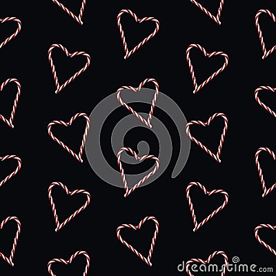 Photographed red and white traditional Christmas heart shaped candy cane on black background sealess pattern Stock Photo