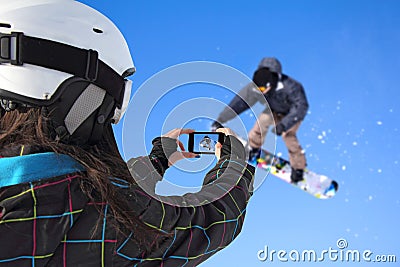 Photographed snowboarder jump with cell phone Stock Photo