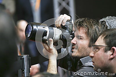 Photographer attends press conference Editorial Stock Photo