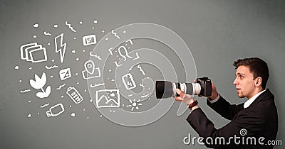 Photographer boy capturing white photography icons and symbols Stock Photo