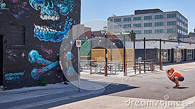 Photographer capturing a cool street scene Editorial Stock Photo