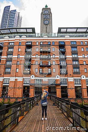 Photographer capturing OXO Tower from river jetty Editorial Stock Photo