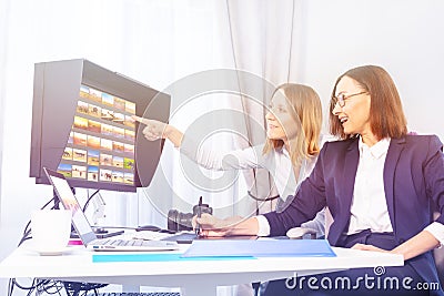 Photographer and client choosing portfolio images Stock Photo